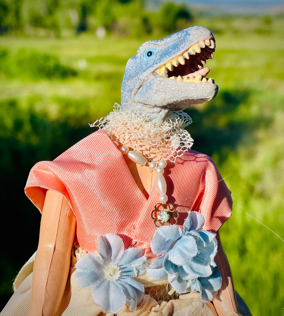 Vintage toy dinosaur in handpainted, beaded dress and beaded necklace, flower waistline