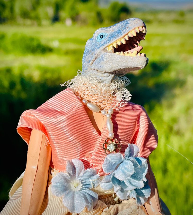 Vintage toy dinosaur in handpainted, beaded dress and beaded necklace, flower waistline
