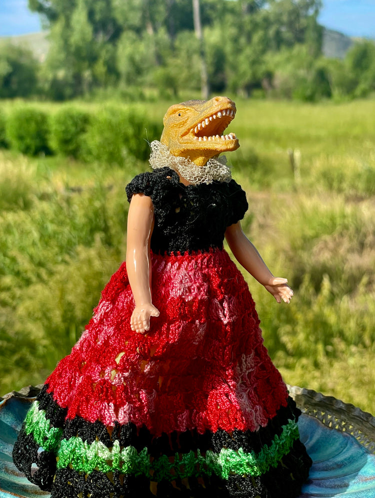 Vintage toy doll in hand crocheted dress and lace collar . 6" tall x 3" wide 