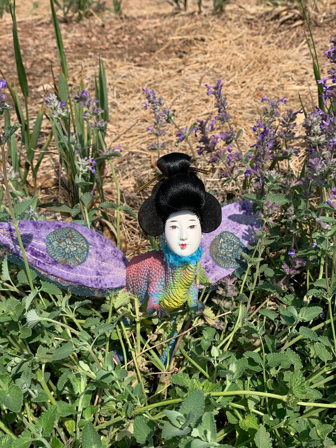 Toy dinosaur body with geisha head and handcrafted wings of velvet, gauze, vintage silk and gold thread. 7"x 7"